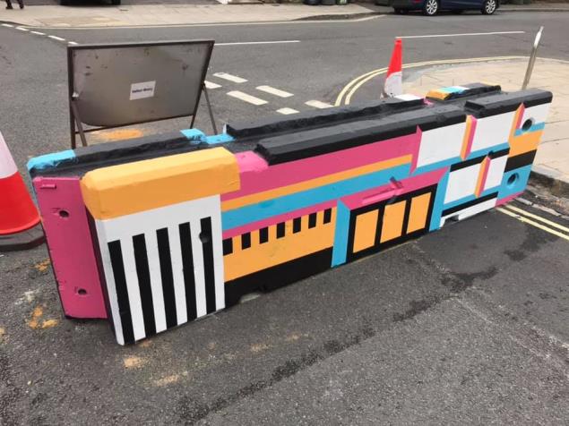 A colourful design on a road block